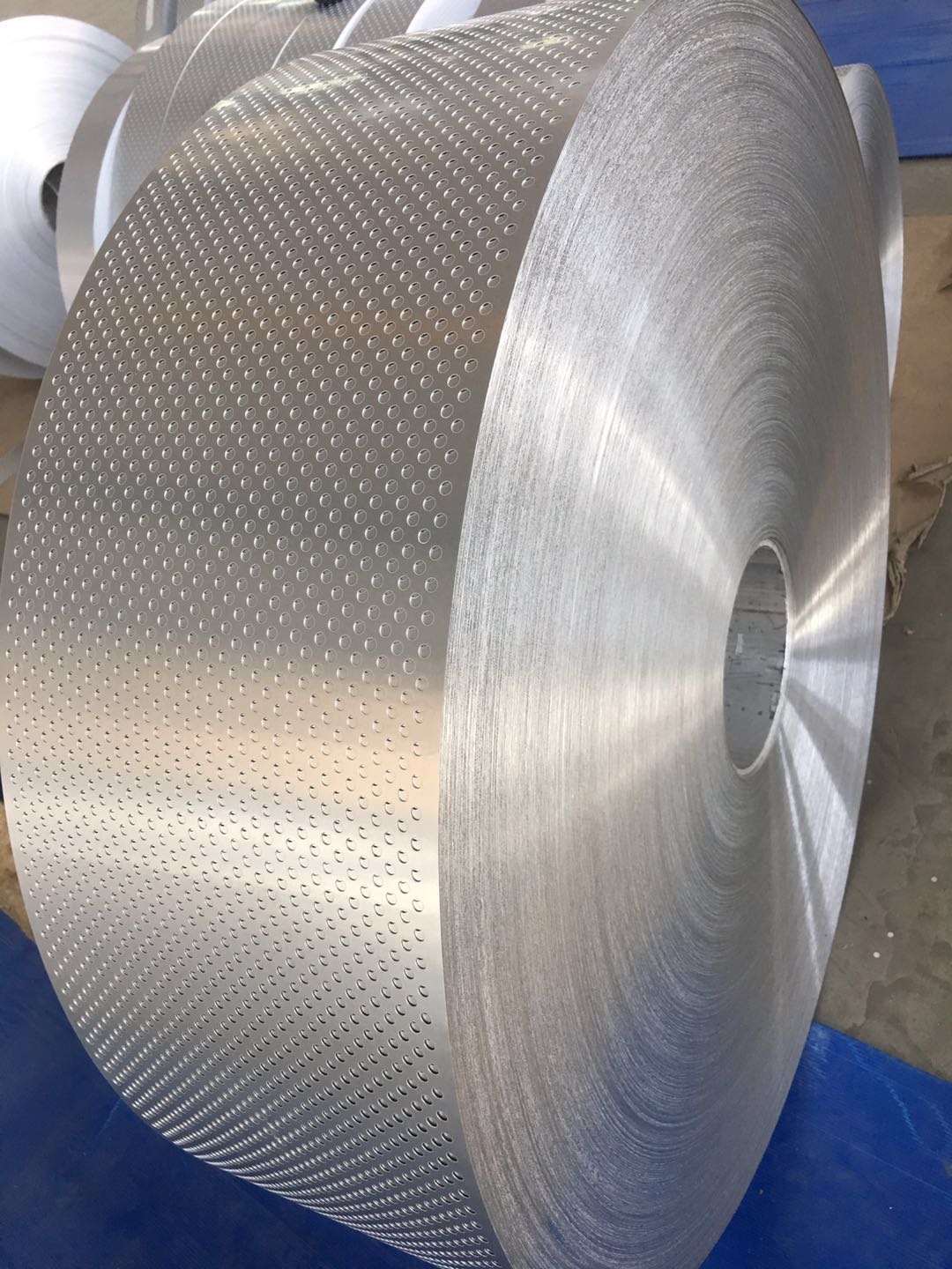 Coil of perforated aluminium strip